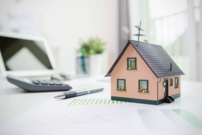 nagative equity home - photo of little house, calculator